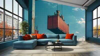 Loading red shipping container with crane against blue sky Wall mural