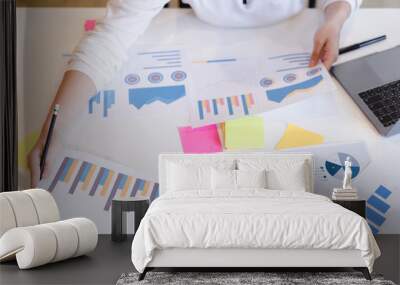 Attractive business woman analyzing brainstorming business reports. Business analysis and strategy concept Wall mural