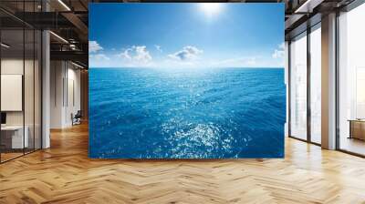 a sparkling blue sea under a clear sky Wall mural