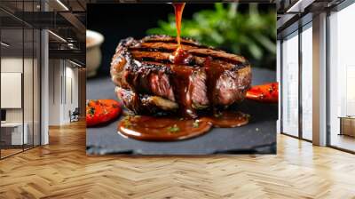 grilled steak with melted barbeque sauce on a black and blurry background Wall mural