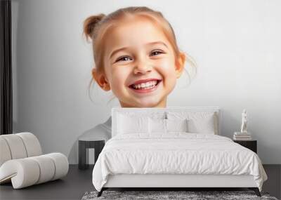 there is a young girl smiling and wearing a white sweater. Wall mural