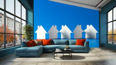 close up of house cut out of paper on blue background Wall mural