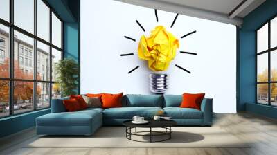 Great idea concept with crumpled yellow paper light bulb isolated on white background Wall mural