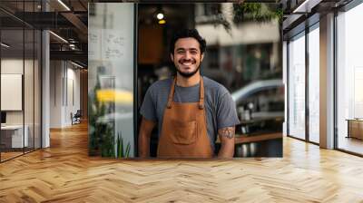 Smiling Male Barista in a Cozy Coffee Shop Wall mural