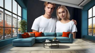 Two hipster models man and woman wearing blank t-shirt, posing against white wall, front tshirt mockup for couple Wall mural