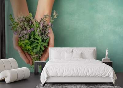 Hands cradling a vibrant bouquet of medicinal herbs, lush green backdrop providing a serene ambiance, ample space for informative text at the top, inviting and organic feel Wall mural