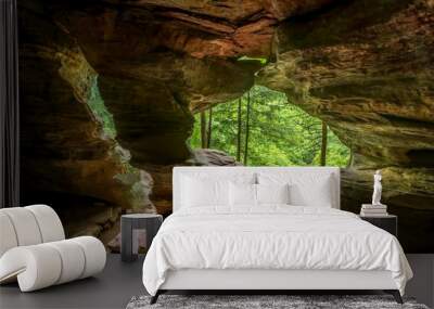 In Hocking Hills State Park, Ohio, Rock House is a twenty-five foot tall cave, on the side of a tall sandstone cliff, with seven natural Gothic-arched windows lighting its two hundred foot length. Wall mural