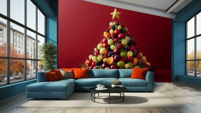 Christmas fruit platter arranged in the shape of a Christmas tree with festive decorations Wall mural