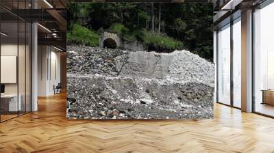 Entrance to the abandoned mine in the mountain Wall mural