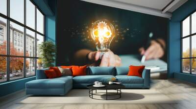 Concept Idea and innovation. Business people holding lightbulb.   Wall mural