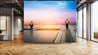 Technology solar cell, Engineers walking on roof inspect and check solar cell panel, service check installation solar cell on the roof of factory, repair solar cell on the roof of factory in morning. Wall mural