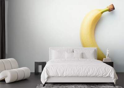 A Single Banana on a White Background Wall mural