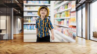 little boy walking in minimart to shopping Wall mural