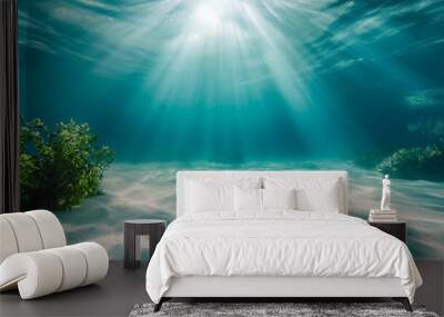 Sunlight filtering through water illuminating sandy ocean floor. Wall mural