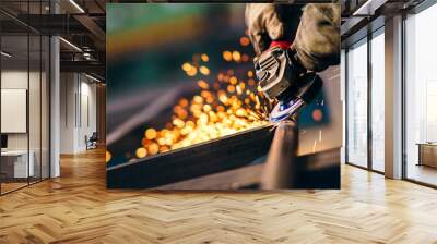 Heavy industry worker with grinder Wall mural