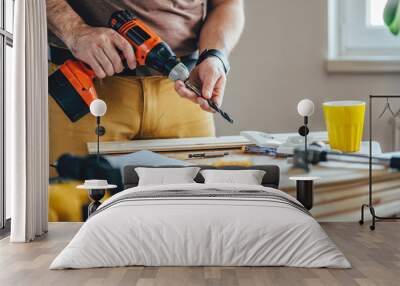 Man using cordless drill Wall mural