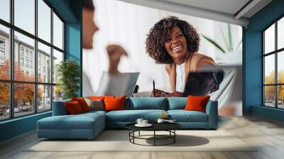 Portrait of cheerful businesswoman smiling at the meeting Wall mural