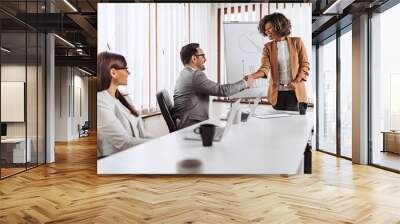 Successful business people handshake after the meeting Wall mural