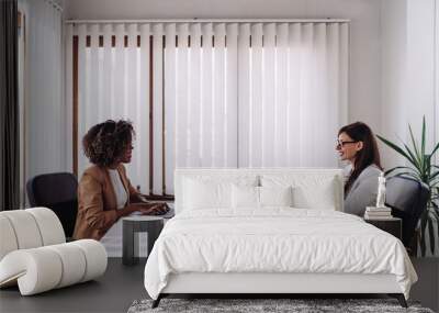 Two woman having business meeting Wall mural