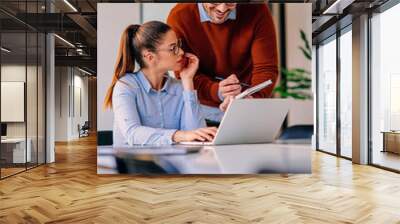 Young businesspeople working together Wall mural