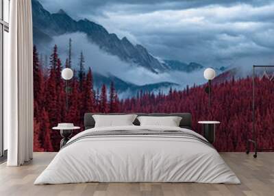 Winding Road, Disappearing into a red Tree Forest, with Misty Mountains and cloudy skies, shot in Infrared Wall mural