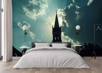 Backlit silhouette of a church spire rising above the rooftops, pointing towards the heavens Wall mural