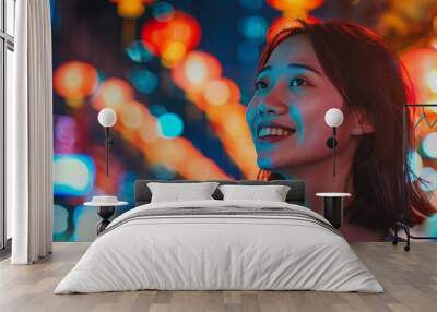 Enthusiastic Asian woman exploring a vibrant city at night Wall mural