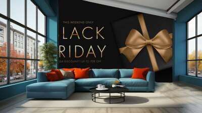 Black friday sale background with gift box and golden ribbon bow. Mega discount Luxury gold and white text. Wall mural