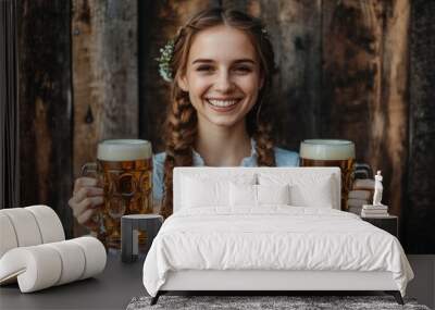 Close-up photo of a woman in dirndl, traditional festival dress, holding two mugs of beer in her hands. Oktoberfest, St. Patrick’s day, international beer day concept. Wall mural