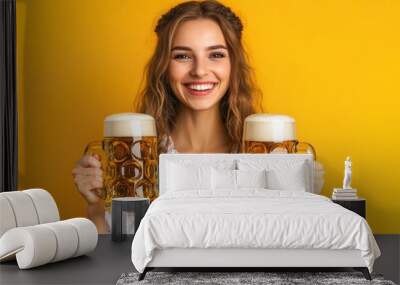 Close-up photo of a woman in dirndl, traditional festival dress, holding two mugs of beer in her hands. Oktoberfest, St. Patrick’s day, international beer day concept. Wall mural