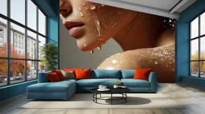 Woman, shoulder and shower with water for hygiene, droplets or wash on a pink studio background. Close up of female person or young model with natural liquid in skincare, hydration or cleanliness Wall mural