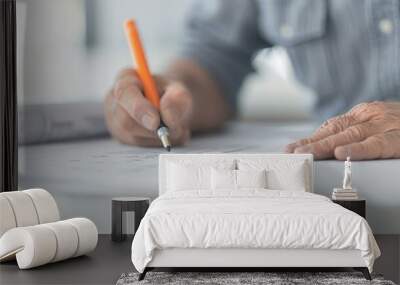 white male architect reviewing civil drawings on table, construction site, professional, focused Wall mural