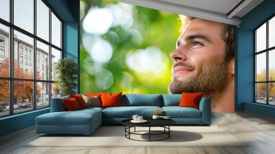 Confident Man Enjoying a Moment Outdoors Wall mural