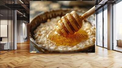 a bowl of oatmeal with a wooden spoon Wall mural