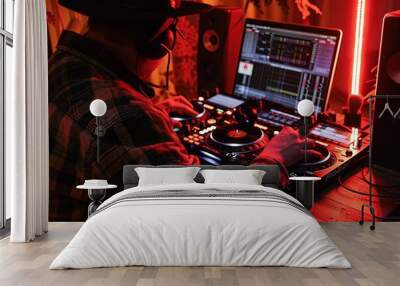 a dj mixing music in front of a laptop Wall mural