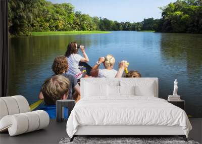 A group of wildlife surveyors canoes through the canals of Tortuguero National Park, Costa Rica. Wall mural