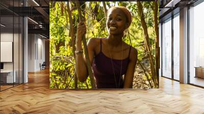 young woman in nature laughing Wall mural