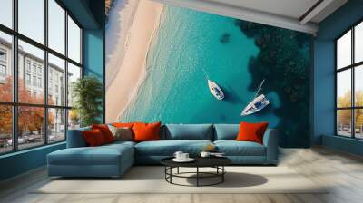 two boats floating in the water next to a sandy beach Wall mural