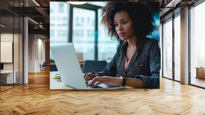 Young African American focused female executive manager businesswoman sitting at desk working typing on laptop computer in contemporary corporation office. Generative AI Wall mural