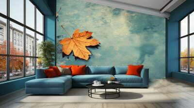 A solitary autumn leaf floats on a calm water surface, creating a peaceful reflection that evokes feelings of nostalgia and introspection during the fall, copy space Wall mural