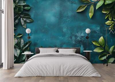 The striking teal backdrop is complemented by an arrangement of various green leaves, adding a natural touch ideal for design or artistic use, copy space Wall mural