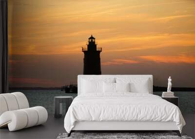 Silhouette of the lighthouse during sunset near Cape Henlopen State Park, Lewes, Delaware, U.S.A Wall mural