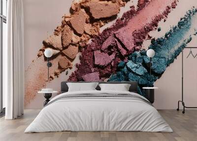 Colorful crushed eyeshadows isolated on bright background Wall mural