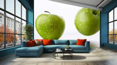 Falling green juicy apple isolated on white background, selective focus Wall mural