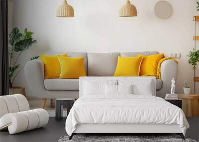 A bright, cheerful living room with a light gray sofa adorned with vibrant yellow pillows Wall mural