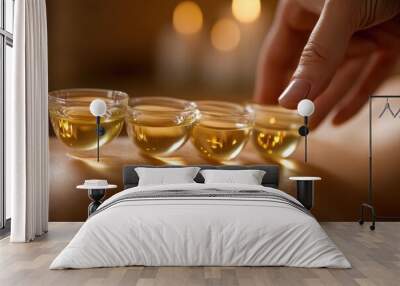 Close-up of a cupping therapy session and glass cups are placed on a person oiled back Wall mural