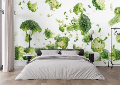 Falling broccoli isolated on white background Wall mural