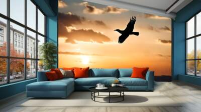 Silhouette of a bird flying over the sunset sky background made with Generative AI Wall mural