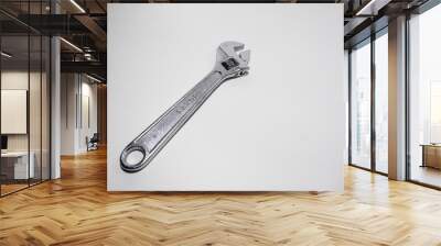 Chrome wrench on white background Wall mural