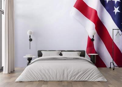 A red, white and blue American flag with stars. The flag is waving in the wind. The flag is a symbol of the United States and represents freedom and patriotism. Wall mural